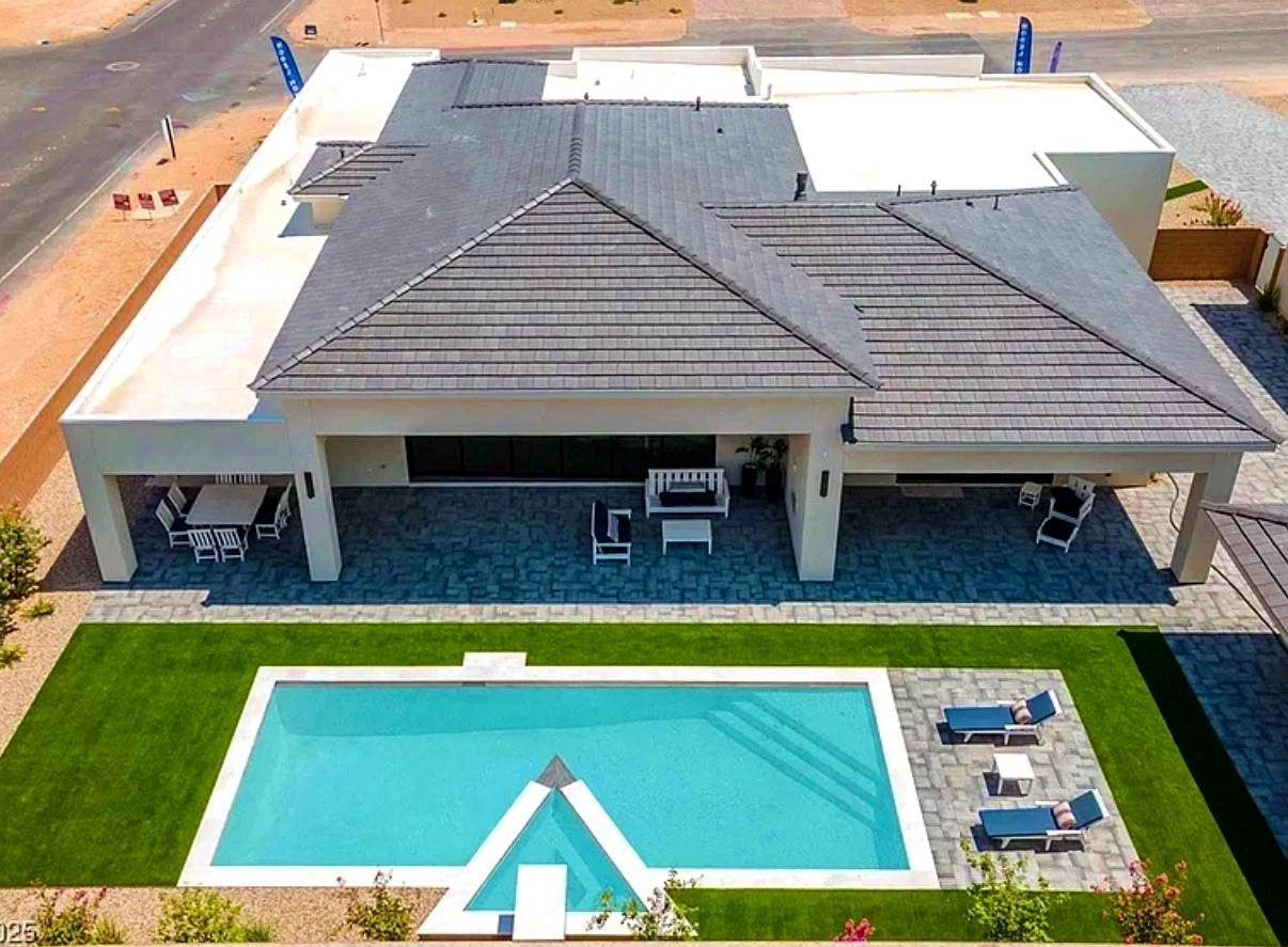 Aerial view of a completed Custom Builds home with pool