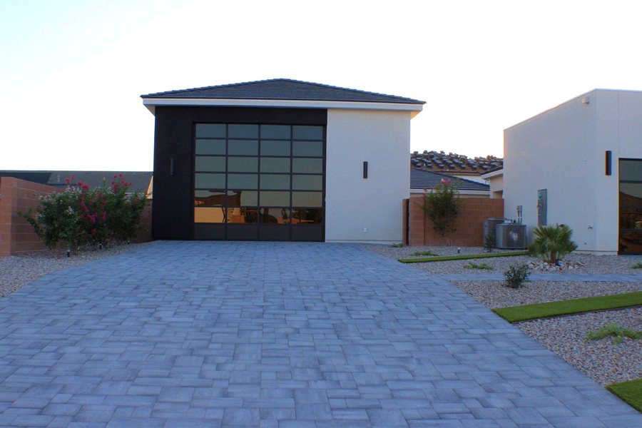Modern single-story elevation with paver driveway