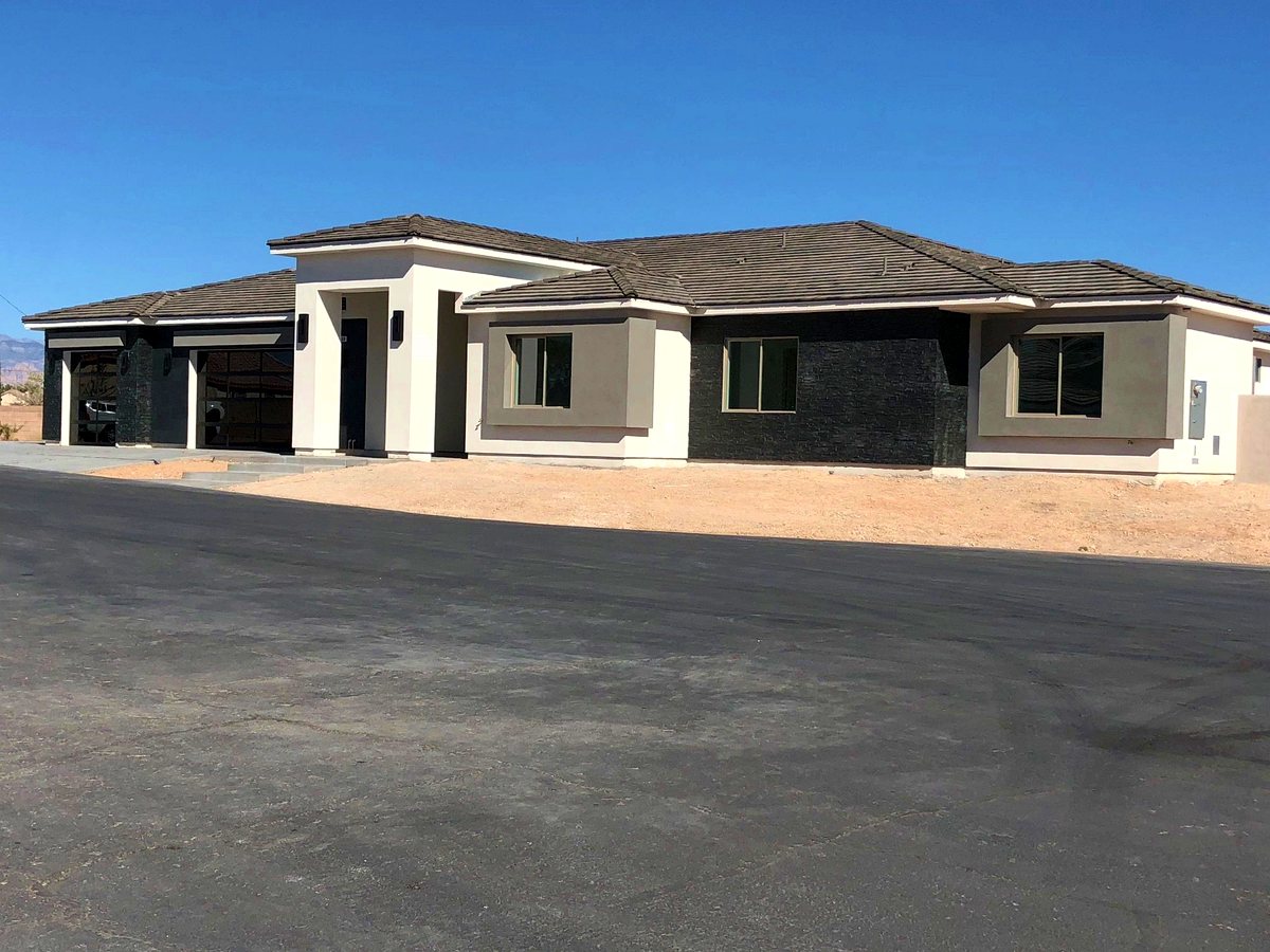 Completed single-story home with oversized garage bays